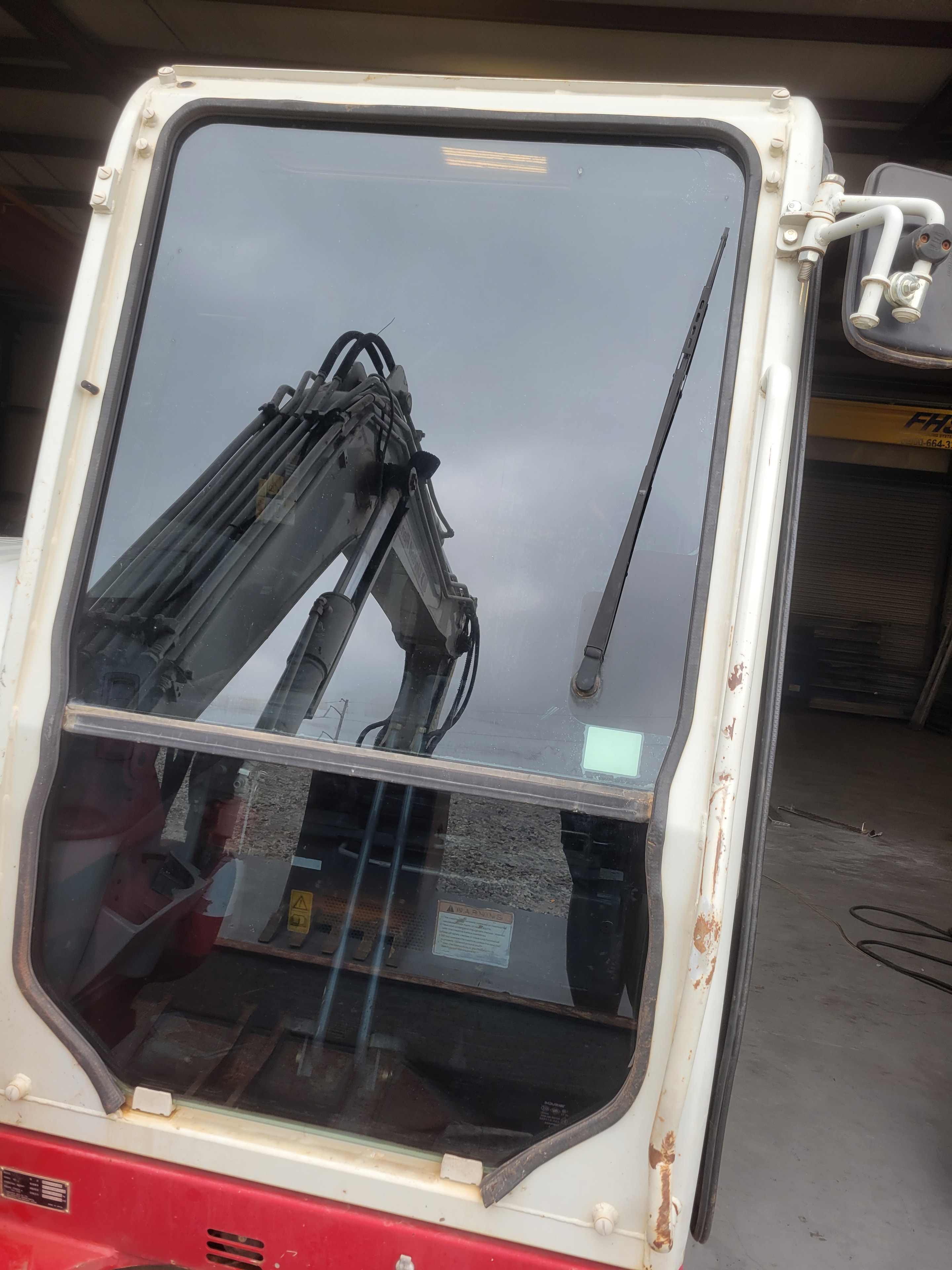 Trackhoe construction equipment cab window tint project